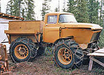 a truck with big wheels and chains